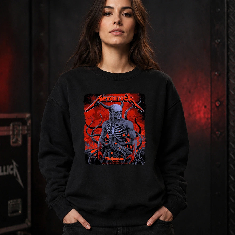 Metallica M72 World Tour November 8 2025 Marvel Stadium Melbourne Australia T-shirt by Ken Taylor featuring a horned skeletal figure, exposed ribcage, twisting tendrils, red smoke, infernal landscape and Melbourne event text.